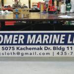 The new sign for Homer Marine is waiting to be installed on Thursday, Dec. 17, 2020, at the store in the Northern Enterprises Boatyard in Homer, Alaska. (Photo by Michael Armstrong/Homer News)