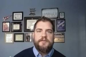 Screen capture 
Alaska Department of Health and Social Services Commissioner Adam Crum speaks in a Zoom meeting on Monday, Nov. 16, in Anchorage.