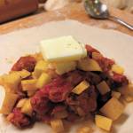 A dollop of butter or margarine on top of the filling before baking a pasty can never hurt, as seen here on Christmas Day, Dec. 25, 2020 in Crystal Falls, Michigan. (Photo by Megan Pacer/Homer News)