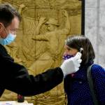 Peter Segall / Juneau Empire File
Rep. Jennifer Johnston, R-Anchorage, gets her temperature taken as she enters the Alaska State Capitol on Monday, May 18, 2020. New policies will require all staff and legislators to wear masks in chambers.