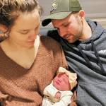Victoria and Robert Walker hold their daughter, Eleanor, Homer's New Year baby. (Photo courtesy Derotha Ferraro/South Peninsula Hospital)