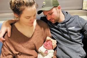 Victoria and Robert Walker hold their daughter, Eleanor, Homer's New Year baby. (Photo courtesy Derotha Ferraro/South Peninsula Hospital)