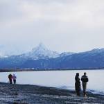 People walk the beach on the New Years Eve, Dec. 31, 2020, at Mariner Park on the Homer Spit in Homer, Alaska. (Photo by Michael Armstrong/Homer News)