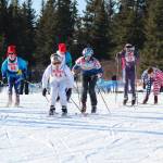 Varsity boy skiers take off from the starting line in a mass start for a 5 kilometer skate ski race Saturday, Feb. 3, 2018 at the Lookout Mountain Ski Trails near Homer, Alaska. (Photo by Megan Pacer/Homer News)