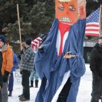 Charles Aguilar wears a President Donald Trump puppet at a protest against Trump on Saturday, Jan. 9, 2021, at WKFL Park in Homer, Alaska. He was part of about 50 people who reacted to the events of Jan. 6, 2021, in which rioters broke into the U.S. Capitol while Congress attempted to tally the Electoral College results in which former Vice President Joe Biden won the presidential election. (Photo by Michael Armstrong/Homer News)