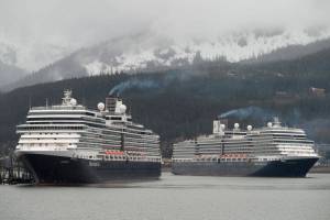 The Holland America Line cruise ships Eurodam, left, and Nieuw Amsterdam pull into Juneaus downtown harbor on May 1, 2017. Holland America extended its pause on sailings to Alaska until mid-May as the company tries to find ways to sail under new health regulations. (Michael Penn / Juneau Empire File)
