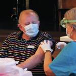 Peter Zuyus finishes getting his first dose of the Moderna vaccine Friday, Jan. 15, 2021 at a large-scale clinic put on by South Peninsula Hospital and the City of Homer at Christian Community Church in Homer, Alaska. The clinic was able to give 700 appointments to seniors, who were recently authorized to get the vaccine in Alaska. (Photo by Megan Pacer/Homer News)