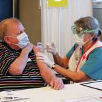 Peter Zuyus receives his first dose of the Moderna vaccine Friday, Jan. 15, 2021 at a large-scale clinic put on by South Peninsula Hospital and the City of Homer at Christian Community Church in Homer, Alaska. (Photo by Megan Pacer/Homer News)