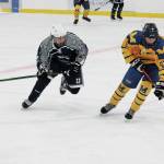 Soldotnas Silas Larsen puts pressure on Homers Matfey Reutov during a Saturday, Jan. 23, 2021 hockey game at Kevin Bell Arena in Homer, Alaska. (Photo by Megan Pacer/Homer News)