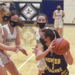 Homers Sailey Rhodes confronts a trap of Soldotnas Jolie Widaman, Josie Sheridan and Rhys Cannava on Tuesday, Jan. 26, 2021, at Soldotna High School in Soldotna, Alaska. (Photo by Jeff Helminiak/Peninsula Clarion)