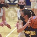 Homer's Sailey Rhodes confronts a trap of Soldotna's Jolie Widaman, Josie Sheridan and Rhys Cannava on Tuesday, Jan. 26, 2021, at Soldotna High School in Soldotna, Alaska. (Photo by Jeff Helminiak/Peninsula Clarion)