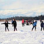 Friends and families skate along several paths plowed onto Beluga Lake for the Skate the Lake event Saturday, Feb. 6, 2021 in Homer, Alaska. It was hosted for the community by the Homer Hockey Association. (Photo by Megan Pacer/Homer News)