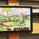 The winning design of this years beer label contest for Kachemak Bay National Estuarine Research Reserve by James Schloemer hangs on the wall of Grace Ridge Brewery during a First Friday art exhibit opening on Friday, Feb. 5, 2021 at the brewery in Homer, Alaska. The label is for the brewerys 64 Afterbock beer, and this years contest theme was resiliency. (Photo by Megan Pacer/Homer News)