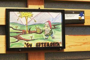 The winning design of this year's beer label contest for Kachemak Bay National Estuarine Research Reserve by James Schloemer hangs on the wall of Grace Ridge Brewery during a First Friday art exhibit opening on Friday, Feb. 5, 2021 at the brewery in Homer, Alaska. The label is for the brewery's '64 Afterbock beer, and this year's contest theme was resiliency. (Photo by Megan Pacer/Homer News)