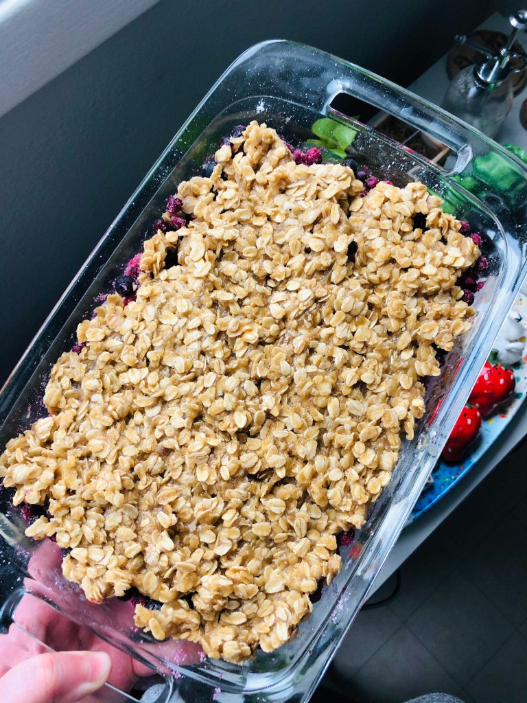 A blueberry crumble ready to be baked for friends and family, photographed on Tuesday, Feb. 16, 2021, in Anchorage, Alaska. (Photo by Victoria Petersen/Peninsula Clarion)