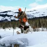 Photo courtesy / Mike Chihuly
Mike Chihuly and Crosson look for a good place to cross open water during a ptarmigan hunt in the Kenai Mountains.