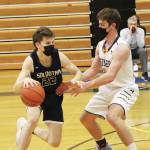 Soldotnas Ethan Sewell looks for a way around Homers Clayton Beachy during a Tuesday, March 2, 2021 basketball game in the Alice Witte Gymnasium in Homer, Alaska. (Photo by Megan Pacer/Homer News)