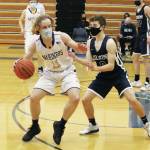 Soldotnas Zac Buckbee defends against Homers Parker Lowney during a Tuesday, March 2, 2021 basketball game in the Alice Witte Gymnasium in Homer, Alaska. (Photo by Megan Pacer/Homer News)