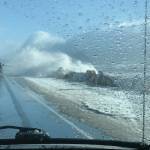 Waves during an extreme high tide and big seas pound the Homer Spit on Sunday afternoon, Feb. 28, 2021, on the Homer Spit, as seen through photographer Malia Andersons windshield. (Photo by Malia Anderson / Homer News)