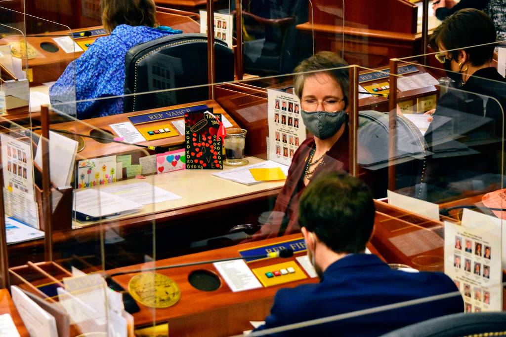 Rep. Sarah Vance, R-Homer, listens as Rep. Zack Fields, D-Anchorage, delivers an apology on Friday, March 5, 2021, for earlier remarks. Vance called for a Sense of the House vote to rebuke Fields for his comments. (Peter Segall/The Juneau Empire via AP, Pool)
