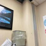 A trash can catches water falling through the hole left by a broken ceiling tile in an office at Homer High School in Homer, Alaska. (Photo courtesy Doug Waclawski)