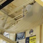 A large tarp hangs in the Homer High School gymnasium to catch water leaking through the roof at the school in Homer, Alaska. (Photo courtesy Doug Waclawski)