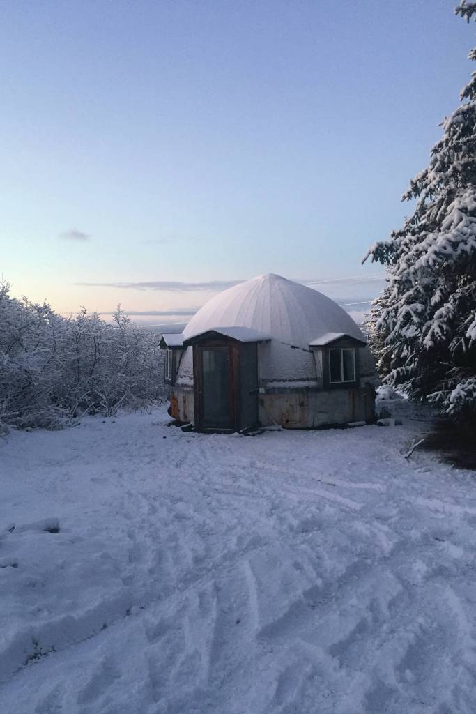The authors first dry cabin sits on a blanket of snow in 2018 on Ohlson Mountain Road near Homer, Alaska. (Photo by Megan Pacer/Homer News)