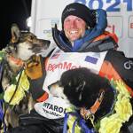Dallas Seavey poses with his dogs after winning the Iditarod Trail Sled Dog Race race near Willow, Alaska, early Monday, March 15, 2021. (Marc Lester/Anchorage Daily News via AP)