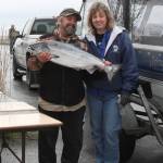 John and Yvonne Ketelle of Homer pose with one of the two king salmon caught on their boat, Circus Circus, at the weigh-in station during the Anchor Point Calcutta on Sunday, May 12, 2019 in Anchor Point, Alaska. (Photo by Delcenia Cosman)