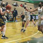 Photo by Tim Rockey/Frontiersman 
Homers Sophie Ellison triggers a shot against Hutchison on Friday, March 26, 2021, at the Class 3A state basketball tournament at Colony High School in Alaska.
