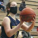 Homer's Sophie Ellison triggers a shot against Hutchison on Friday, March 26, 2021, at the Class 3A state basketball tournament at Colony High School in Alaska. (Photo by Tim Rockey/Frontiersman)