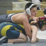 Nikiskis Josh Martin controls Homers Ann Graham at 119 pounds Tuesday, March 30, 2021, at Nikiski High School in Nikiski, Alaska. Martin was able to pin Graham in the first period. (Photo by Jeff Helminiak/Peninsula Clarion)