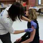 Ashlyn OHara/Peninsula Clarion
Tracy Silta administers a dose of a COVID-19 vaccine to Melissa Linton during a vaccine clinic at Soldotna Prep School on Feb. 26.