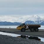 Workers with Psenak Construction return with an empty load after dumping armor rock at the Ocean Drive seawall on Monday, March 22, 2021, at Mariner Park on the Homer Spit in Homer, Alaska. (Photo by Michael Armstrong/Homer News)