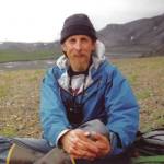 Michael Armstrong is properly outfitted for an Arctic summer hiking trip in this photo taken in 1989 along the Wulik River in northeastern Alaska. (Photo by Charles Barnwell.)