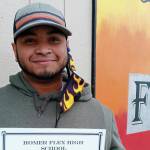 Homer Flex High School Phoenix Award winner David Young holds his certificate on March 25, 2021, at Flex High School in Homer, Alaska. (Photo courtesy of Homer Flex High School)