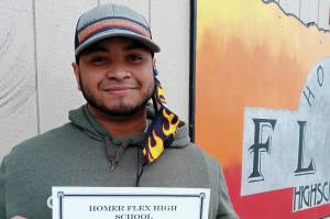 Homer Flex High School Phoenix Award winner David Young holds his certificate on March 25, 2021, at Flex High School in Homer, Alaska. (Photo courtesy of Homer Flex High School)