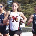 Kenai Centrals Emilee Wilson leads Soldotnas Erika Arthur and Jordan Strausbaugh during the 800-meter run during a dual meet Friday, April 16, 2021, at Kenai Central High School in Kenai, Alaska. (Photo by Jeff Helminiak/Peninsula Clarion)