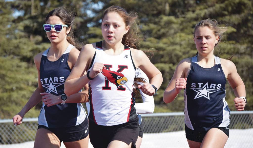 Kenai Centrals Emilee Wilson leads Soldotnas Erika Arthur and Jordan Strausbaugh during the 800-meter run during a dual meet Friday, April 16, 2021, at Kenai Central High School in Kenai, Alaska. (Photo by Jeff Helminiak/Peninsula Clarion)