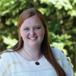 Homer News reporter Sarah Knapp poses for a photo on Tuesday, April 27, 2021, at the newspaper offices in Homer, Alaska. (Photo by Michael Armstong/Homer News)