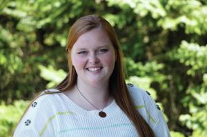 Homer News reporter Sarah Knapp poses for a photo on Tuesday, April 27, 2021, at the newspaper offices in Homer, Alaska. (Photo by Michael Armstong/Homer News)