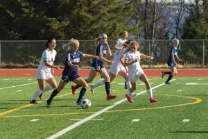 Lady Mariners Sela Weisser manuevers her way down field during the Homer girls vs. Grace Christian School soccer game April 30, 2021, at the Homer High School soccer field. (Photo by Sarah Knapp/Homer News)