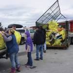 Volunteers unload trash on April 22, 2017, at the Homer Chamber of Commerce and Visitor Center in Homer, Alaska, for that year's clean up day. (Photo by Michael Armstrong/Homer News)