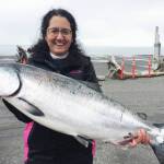 Derotha Ferraro from the fishing vessel Big Game poses with the king salmon she caught at the Anchor Point King Salmon Calcutta on Sunday, May 12, 2019, in Anchor Point, Alaska. Ferraro’s fish was one of the top ten fish caught in the tournament, weighing more than 20 pounds. (Photo courtesy of Bill Scott)