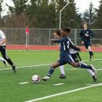 Homer High School senior Eyoab Knapp dribbles the ball toward the goal during the Homer vs. Redington game May 14. The host Mariners won 5-1. (Photo by Sarah Knapp/Homer News)