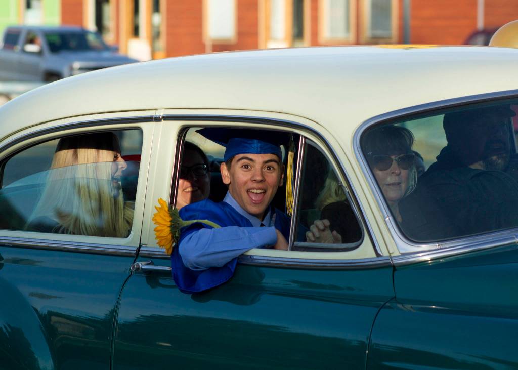 A Homer High School senior celebrates his graduation during the parade through Homer. (Photo by Sarah Knapp/Homer News)