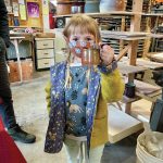 On Saturday, May 15, 2021, Lulu Hawkins, age 6 holds up her pottery tour purchase: a David Kaufmann mug at his studio in Homer, Alaska. (Photo by David Kaufman)