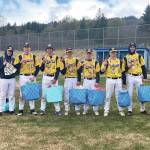 Seven seniors on the Homer High School baseball team were honored Saturday, May 22 during senior night. The team won against Kenai 11-3. Pictured left to right: Jack Strydom, Josiah Raymond, Liam Houlihan, Austin Ceccarelli, Harrison Metz, Charly Tappen and Coda Wood. (Photo by Sarah Knapp/Homer News)
