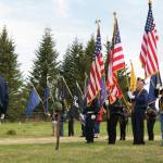 The American Legion Post 16, Homer, American Legion Post 19, Ninilchik, Veterans of Foreign Wars Post 10221, Anchor Point, color guard stands at attention while Taps is played in honor of all servicemen and women who died in service to the United States of America. The veterans organizations hosted the Memorial Day service at Hickerson Memorial Cemetery May 31. (Photo by Sarah Knapp/Homer News)