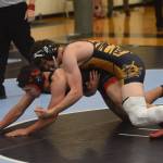 Homer High School senior Josh Bradshaw wrestles in the state championship in Chugiak, Alaska on Saturday, May 22, 2021. (Camille Botello / Peninsula Clarion)
